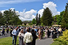 Crowd of spring '22 graduates, family, friends at ACM Cumberland campus