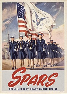 SPARS on parade in dress uniforms with the U.S. flag and that of the USCG