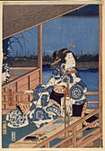 Pogled v mesečini na Tsukudo z damo na balkonu