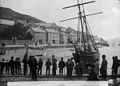A group of men and boys standing on the quayside, Aberdyfi. Aberdyfi Regatta. John Thomas c. 1885