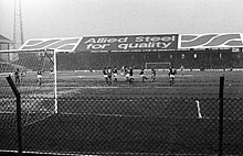 A black and white image of a football match.
