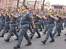 Uniformed agents marching in a parade