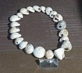 Image 2A necklace reconstructed from perforated sea snail shells from Upper Palaeolithic Europe, dated between 39,000 and 25,000 BCE. The practice of body adornment is associated with the emergence of behavioral modernity. (from Nudity)
