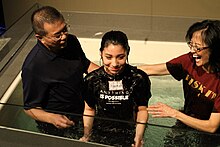 photo of teenage girl being baptized at Eastside Christian church