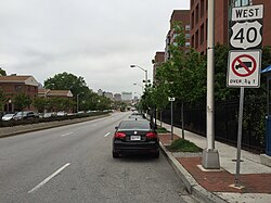 View west on Orleans Street in Dunbar-Broadway, Baltimore, with Johns Hopkins Medical Campus on the right and residential buildings on the left