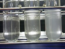 Three clear test tubes containing solutions of successively increasing turbidity.