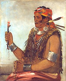 Painting of Tenskwatawa in traditional attire holding religious items