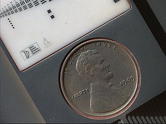 1909 VDB "US Lincoln Penny" – on the planet Mars – part of a calibration target on the Curiosity rover (September 10, 2012) (3-D version) (also, image taken on October 2, 2013, after 411 days on Mars).