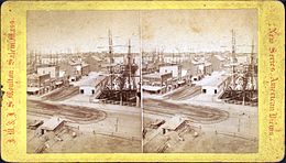 Stereoscopic view of Long Wharf in Boston, United States, c. 19th century, jutting into Boston Harbor