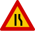 Road narrows on right hand side