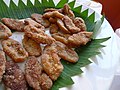 Pinakufu, glutinous rice flour fritters coated in sugar and coconut