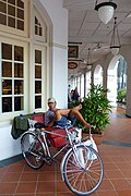 A trishaw and rider at the Raffles Hotel in Singapore