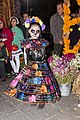 Girl with sugar skull make-up photographed in Mexico City, celebrating Day of the Dead, 2014.
