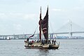 Hokule'a with her kaula pe'a (sail lines) tightened to partly close her crab-claw sails.[18]
