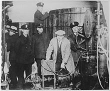 Detroit police inspecting equipment found in a clandestine underground brewery during the prohibition era - NARA - 541928.jpg