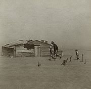 Fermier et ses enfants, pris dans une tempête de poussière dans le comté de Cimarron (Oklahoma). Pour la Farm Security Administration, 1936
