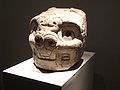 The tusks are present in all the arts of Chavín including in the sculpture as this tenon head.