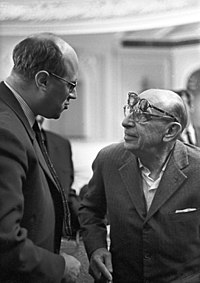 Black and white photo of Stravinsky shaking hands with Rostropovich