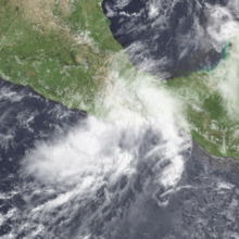 A satellite image of a tropical storm near landfall