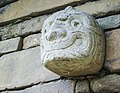Tenon head embedded in one of the walls of the temple of Chavín de Huántar.