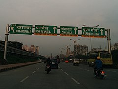 A road sign on Sion Panvel Highway in India instructing travellers to use flyover for onward journey.