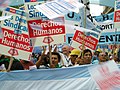 Image 25Union members march in Argentina on Human Rights Day in December 2005. The signs read "Worker rights are human rights..