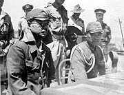 Tư lệnh Trung đoàn xe tăng 4 Nhật Bản là Kaida Tatsuichi, và chánh văn phòng của ông là Shoji Minoru lắng nghe các điều khoản đầu hàng trên HMAS Moresby tại Timor.