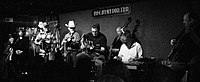 A black-and-white photo of the band The Time Jumpers.