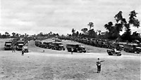 Red Ball Express trucks moving through a Regulating Point, 1944