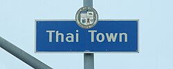 Thai Town neighborhood sign located at the intersection of Normandie Avenue and Hollywood Boulevard.