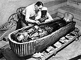 Howard Carter opens the innermost shrine of King Tutankhamun's tomb near Luxor, Egypt, 1922