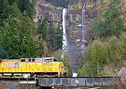 A Union Pacific Railroad locomotive passing the falls