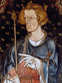 Half figure of Edward facing left with short, curly hair and a hint of beard. He wears a coronet and holds a sceptre in his right hand. He has a blue robe over a red tunic, and his hands are covered by white, embroidered gloves. His left hand seems to be pointing left, to something outside the picture.