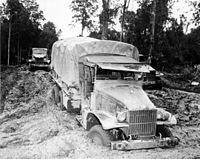A Red Ball Express truck stuck in the mud, 1944
