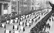 Women's suffragists parade in New York City in 1917, carrying placards with signatures of more than a million women.[184]