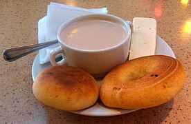 A traditional breakfast of Bogotá: hot chocolate with cheese, almojábanas and pan de queso