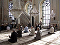 Muslim men praying at the Ortaköy Mosque in Istanbul