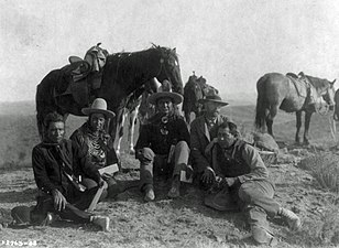 Three of Custer's scouts accompanying Edward Curtis on his investigative tour of the battlefield, circa 1907. Left to right: Goes Ahead, Hairy Moccasin, White Man Runs Him, Curtis and Alexander B. Upshaw (Curtis's assistant and Crow interpreter)