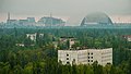 Image 62The town of Pripyat abandoned since 1986, with the Chernobyl plant and the Chernobyl New Safe Confinement arch in the distance (from Nuclear power)