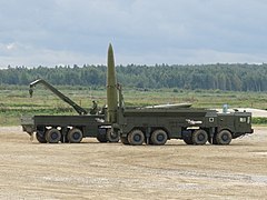 A launcher 9P78-1 of Russian missile system 9K720 Iskander in foreground and a transloader 9T250 in the background shown at Army-2016