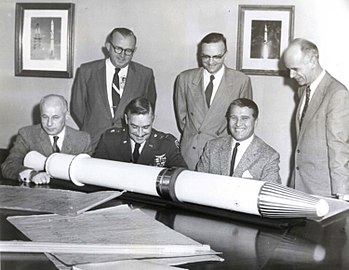 Officials with Explorer 1 model at Redstone Arsenal, including Maj. Gen. John Medaris (3rd from left), Walter Haeussermann, Wernher von Braun and Ernst Stuhlinger