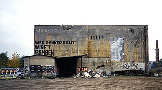 WWII bunker near Anhalter Bahnhof (Berlin) with a graffiti inscription Wer Bunker baut, wirft Bomben (those who build bunkers, throw bombs)