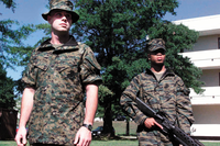 Two U.S. Marines test out early prototypes of the MCCUU in 2001. The two prototypes feature removable sleeves, a feature that was later abandoned on the finished production version. The uniform on the left features an early version of woodland MARPAT.