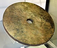 Jade disc (bi). Nephrite jade. Liangzhu Culture, south-east China. Neolithic period, c. 2500 BCE. Victoria and Albert Museum