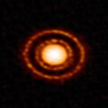 Protoplanetary disc AS 209 nestled in the young Ophiuchus star-forming region.[23]