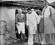 Gandhi touring Bela, Bihar, a village struck by religious rioting in March 1947. On the right is Khan Abdul Gaffar Khan.