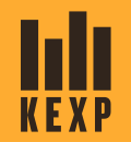 On an orange background, four black bars of different heights above the black letters KEXP in a bold sans serif
