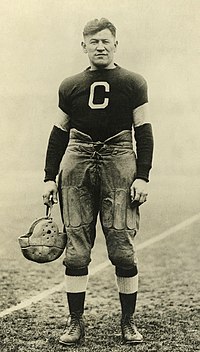 A black-and-white photograph of Jim Thorpe in his Canton Bulldogs football jersey.