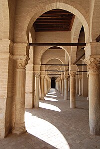 Arcades inside the Mosque of Uqba, also known as the Great Mosque of Kairouan, in Tunisia (670). There is no vaulting; the arches are bridged by wooden beams