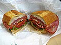 A submarine sandwich, which includes a variety of Italian luncheon meats